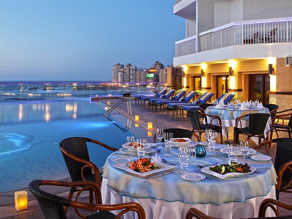 North Coast Egypt Mediterranean sunset with golden sky over calm turquoise sea and empty beach summer