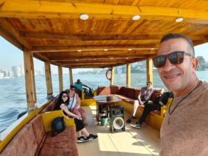 Smiling travelers enjoying their Cairo Giza day trip with pyramid views