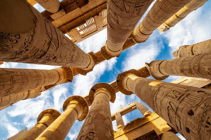 Karnak Temple Hypostyle Hall on a Luxor Nile Cruise Excursion Massive carved sandstone columns inside the Great Hypostyle Hall of Karnak Temple visited on a Nile River Cruise