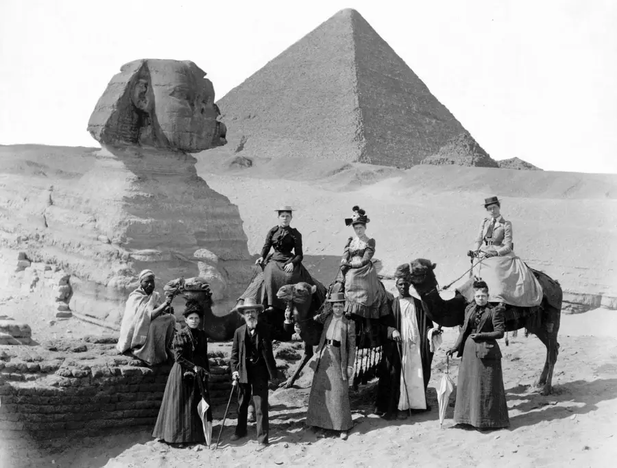Historic 19th-century archival photograph of the Great Sphinx of Giza buried up to its shoulders in desert sand before modern excavation